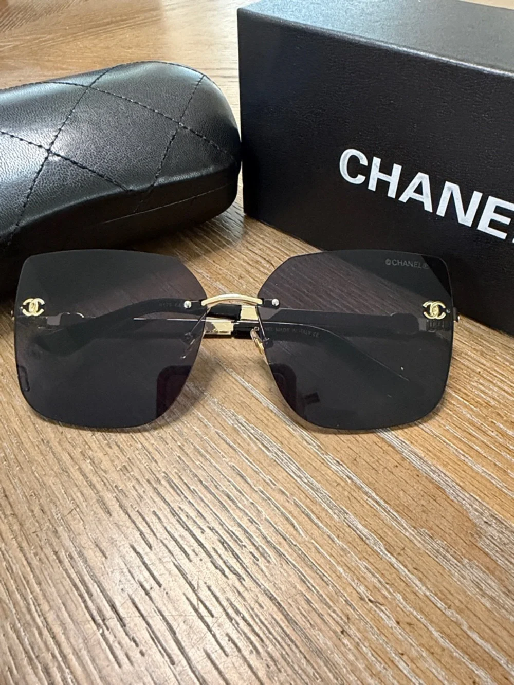 Chanel Women's Black and Gold Rimless Square Sunglasses